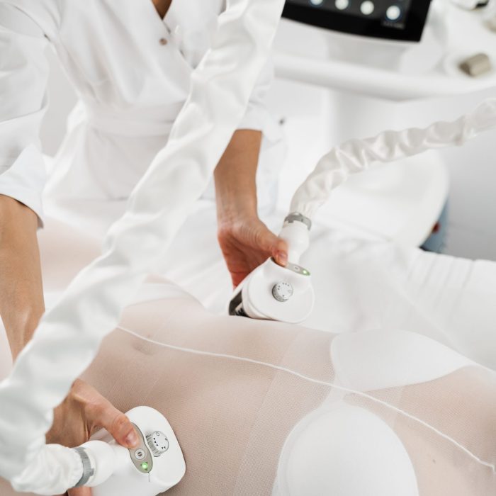 Correction of leg swellings by massaging skin and fatty tissues with mechanical lymphatic drainage. Effective treatment of cellulite and elimination of toxins from the body